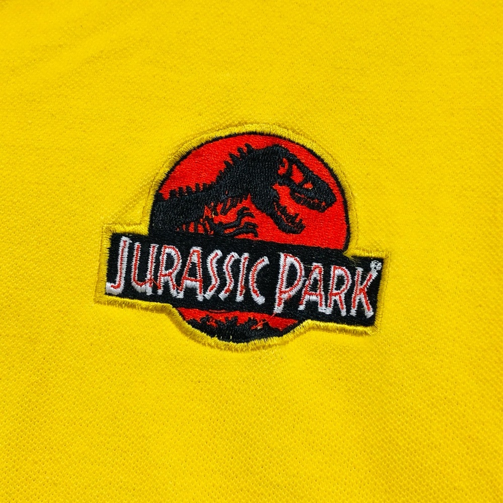 Vintage Jurassic Park from Universal..Bright yellow XL polo.